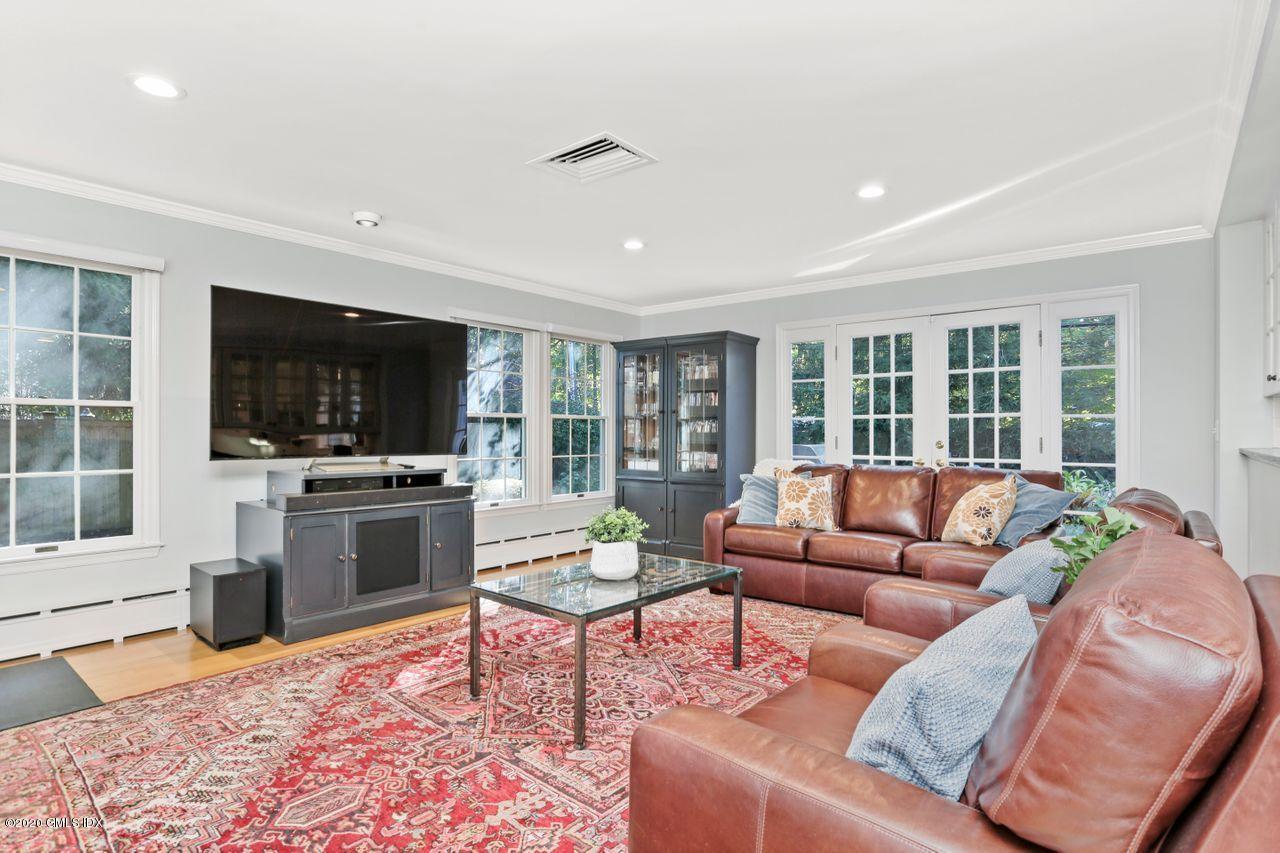 11 Indian Head Road Riverside, CT 06878 - Photo 9 of 30 a living room with furniture and a flat screen tv