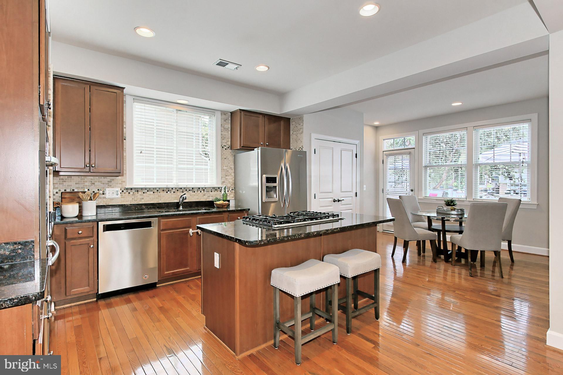 23106 Bronstein Lane Brambleton, VA 20148 - Photo 11 of 58 Chefs Kitchen Features: SS Appliance + Backsplash
