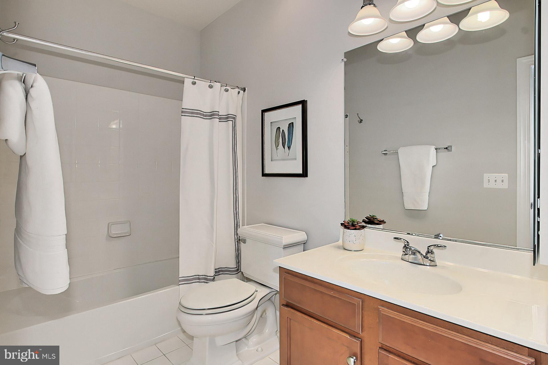 23106 Bronstein Lane Brambleton, VA 20148 - Photo 29 of 58 Ensuite Bath to Bed #4 w Tub/Shower + Tile Flrg