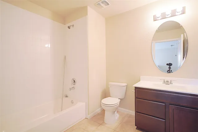 a bathroom with a sink a toilet and bathtub