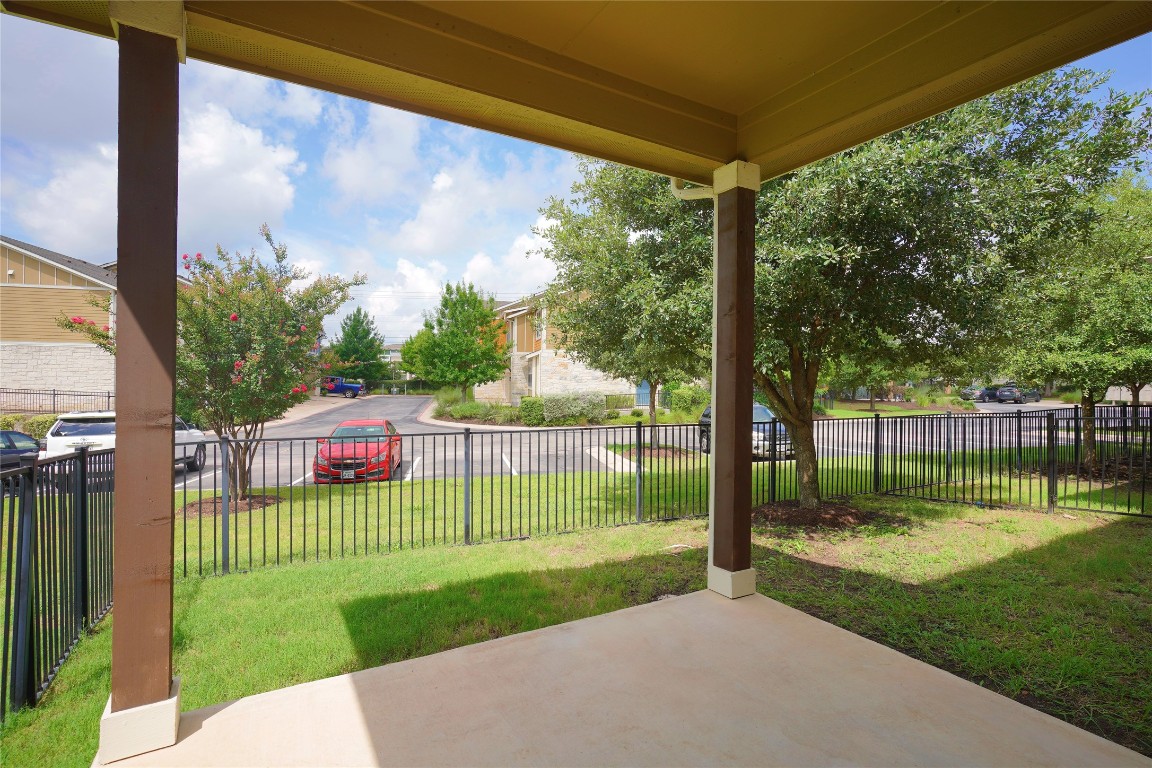 516 East Slaughter Lane, Unit 801 Austin, TX 78744 - Photo 15 of 16 a view of a porch with a big yard and a fountain