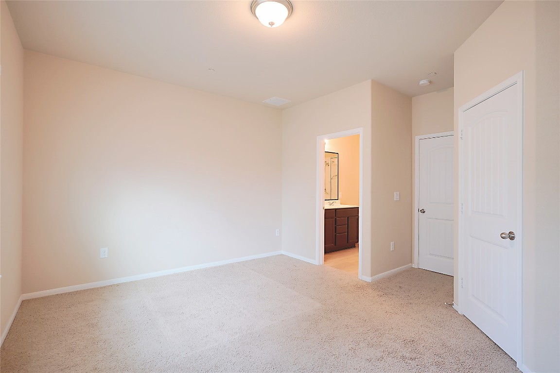 516 East Slaughter Lane, Unit 801 Austin, TX 78744 - Photo 7 of 16 a view of an empty room and window