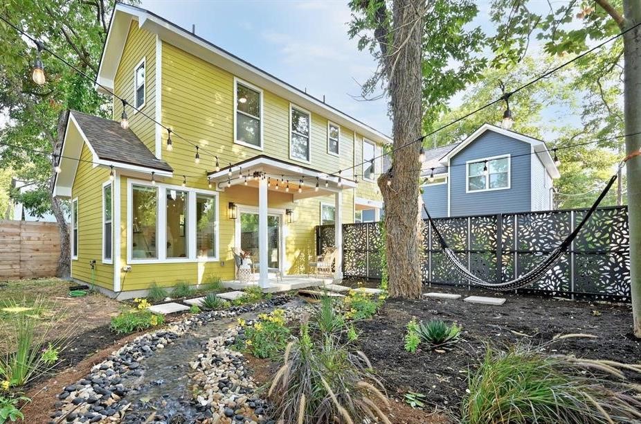 401 Hammack Drive, Unit 2 Austin, TX 78752 - Photo 1 of 1 a front view of a house with garden