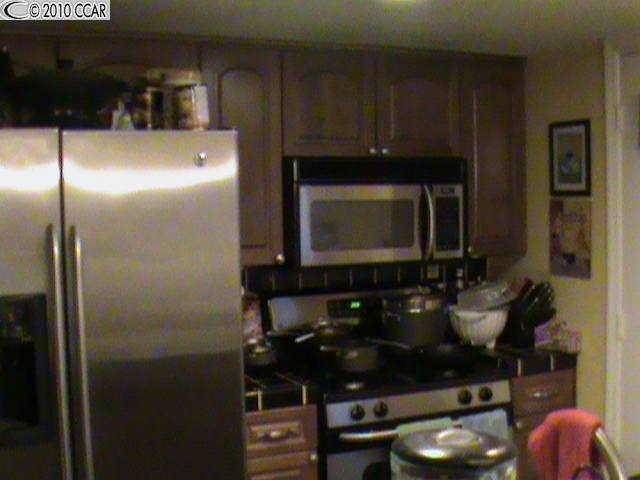 5519 Roundtree Drive, Unit B Concord, CA 94521 - Photo 1 of 1 a bathroom with a sink and a mirror