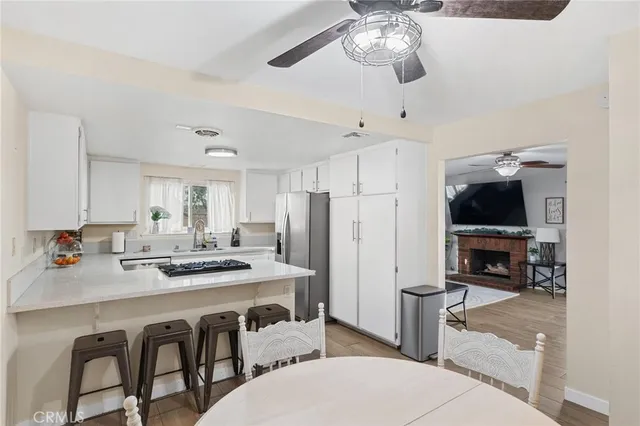 a kitchen with a dining table and chairs