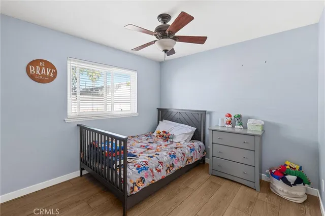 a bedroom with bed and a window