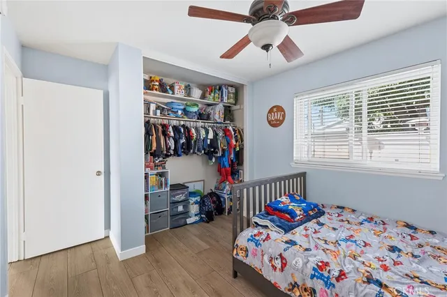 a bedroom with bed and a window