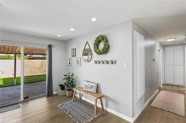 a view of an entryway with wooden floor