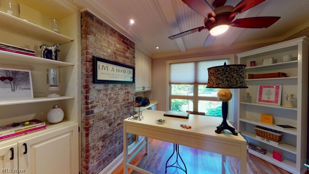 6556 Stone Road Hudson, OH 44236 - Photo 16 of 35 Home office with built-ins. Exposed brick and beadboard ceilings, and hardwood floors.