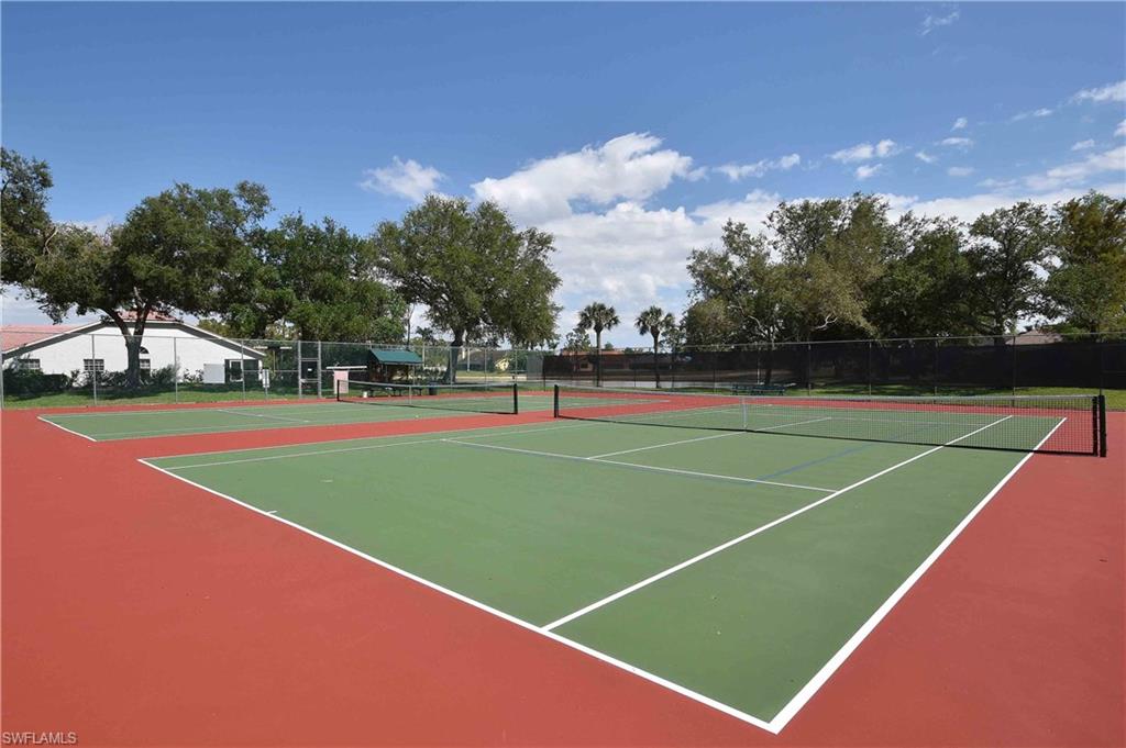 741 Landover Circle, Unit 203 Naples, FL 34104 - Photo 19 of 21 a view of tennis court