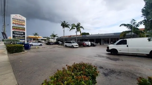 a view of street with parked cars