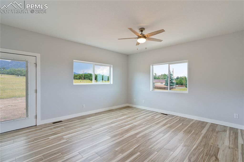 8081 Granger Road Rye, CO 81069 - Photo 15 of 42 a view of empty room with wooden floor and fan