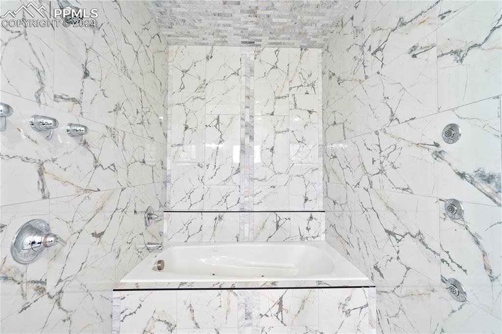 8081 Granger Road Rye, CO 81069 - Photo 20 of 42 a bathroom with a bathtub and shower