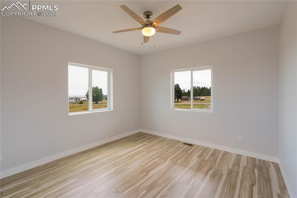8081 Granger Road Rye, CO 81069 - Photo 24 of 42 a view of empty room with wooden floor and fan