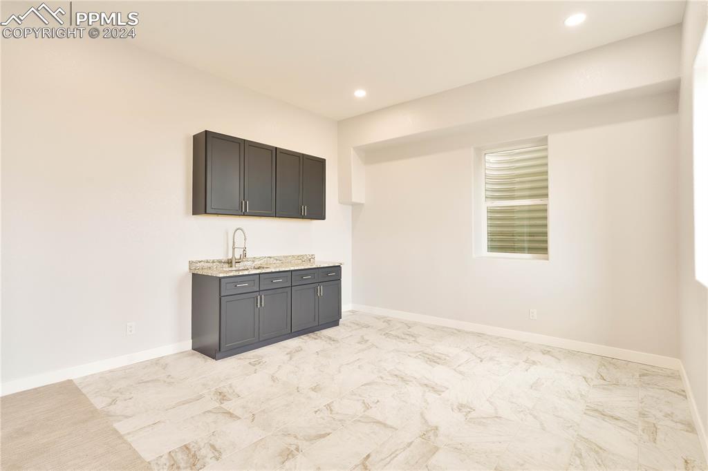 8081 Granger Road Rye, CO 81069 - Photo 32 of 42 a room with a bed and a flat screen tv