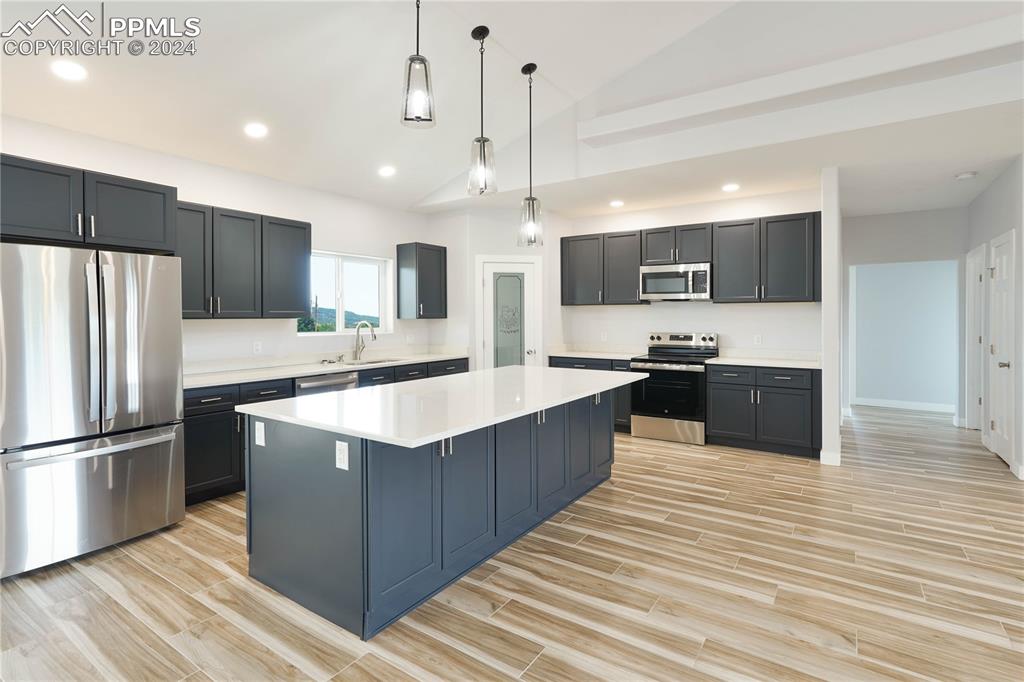 8081 Granger Road Rye, CO 81069 - Photo 9 of 42 a large kitchen with stainless steel appliances and wooden cabinets