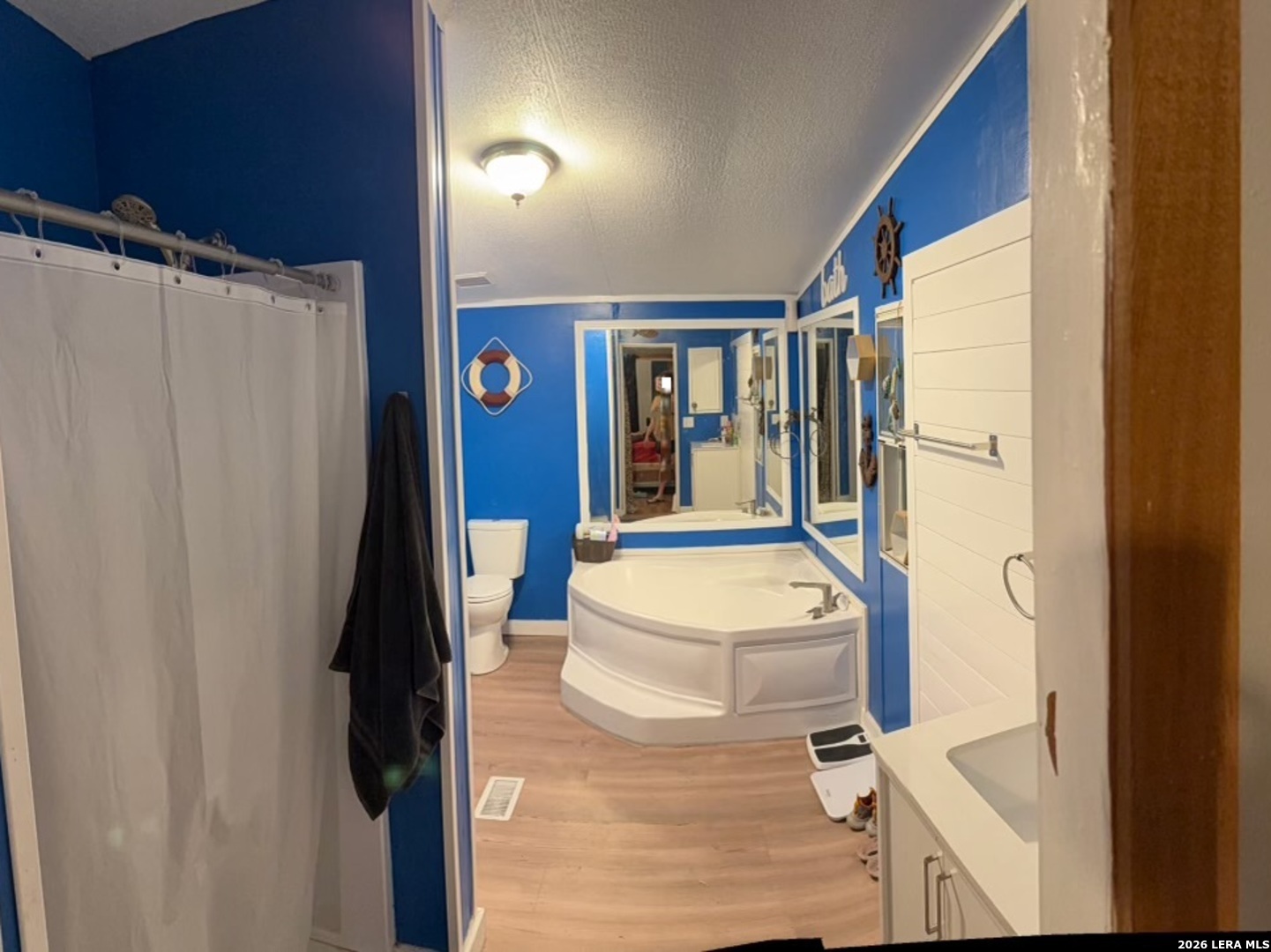6940 Green Valley Road Schertz, TX 78108 - Photo 6 of 17 a bathroom with a sink a toilet and a shower