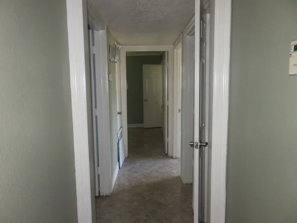 a view of a bathroom from a hallway