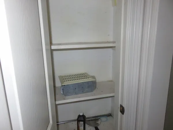a bathroom with a shower and a sink
