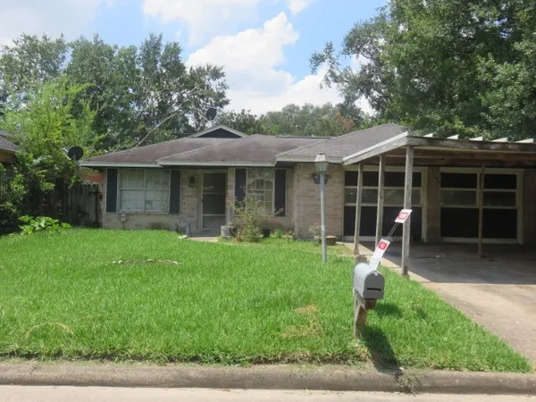 a front view of a house with garden and porch