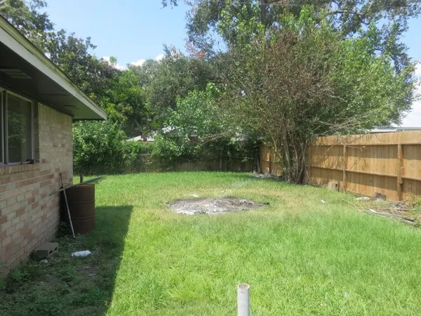a backyard of a house with seating space