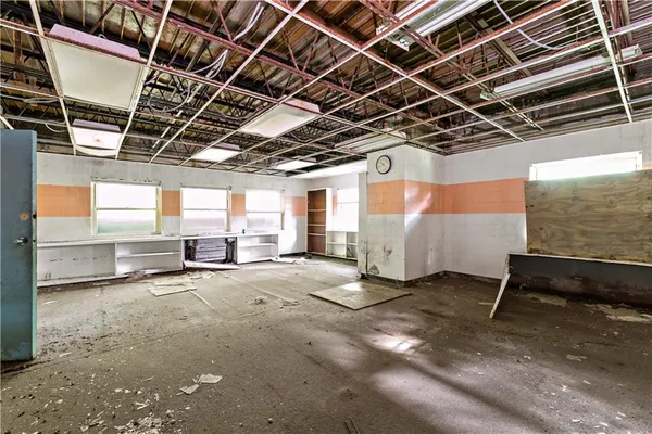 a view of a room with wooden ceiling