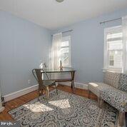 216 Rockingham Road Bryn Mawr, PA 19010 - Photo 20 of 27 a living room with a couch and a window