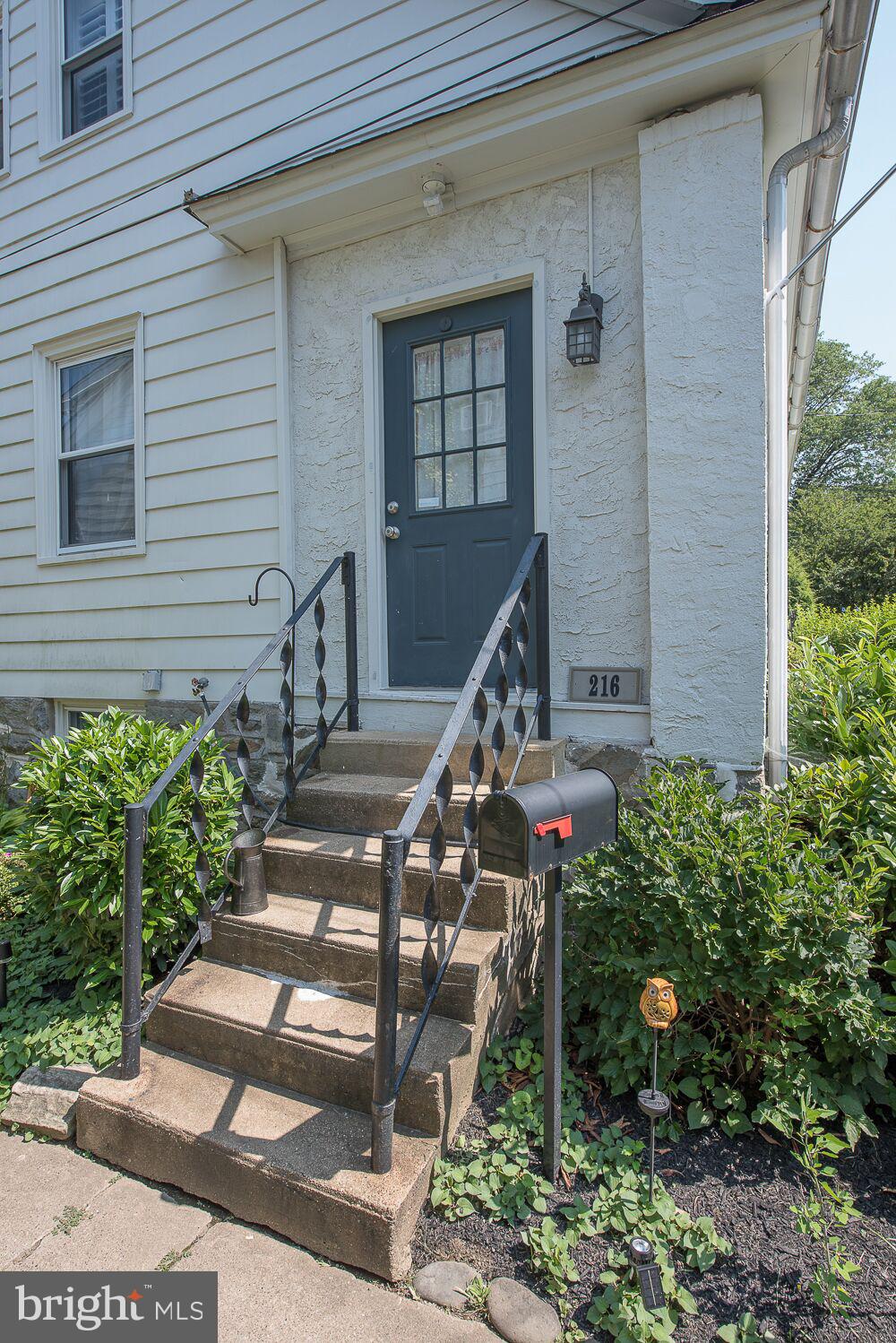 216 Rockingham Road Bryn Mawr, PA 19010 - Photo 3 of 27 a front view of a house with a yard