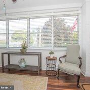 216 Rockingham Road Bryn Mawr, PA 19010 - Photo 5 of 27 a view of a room that has a bed and a table in it
