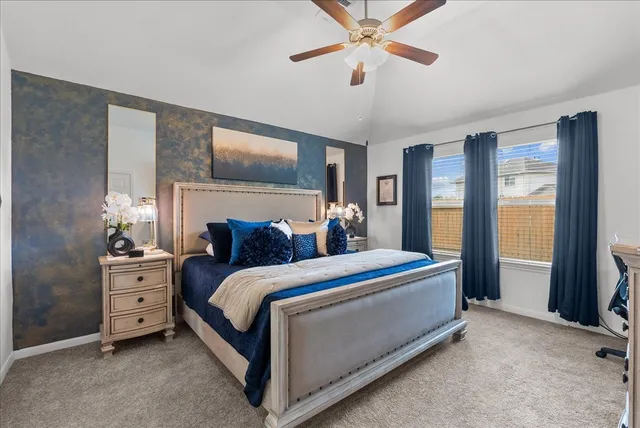 a bed room with a bed and a chandelier