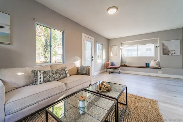a living room with furniture and a window