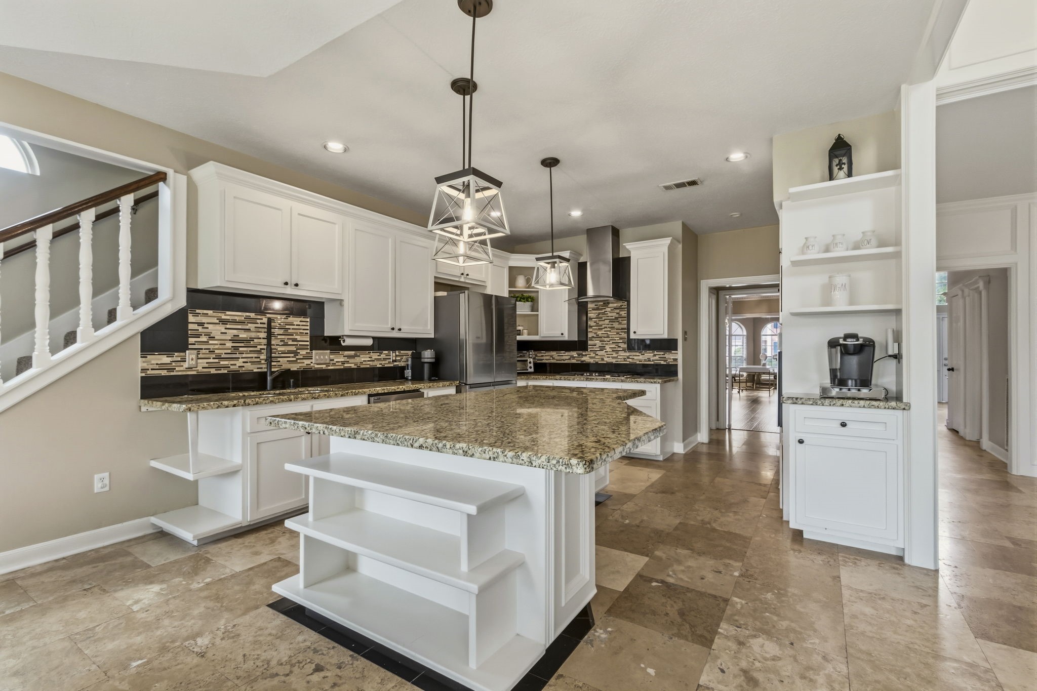 17618 Hidden Forest Drive Spring, TX 77379 - Photo 15 of 49 a large white kitchen with stainless steel appliances