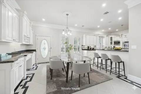 a view of a dining area with furniture and wooden floor