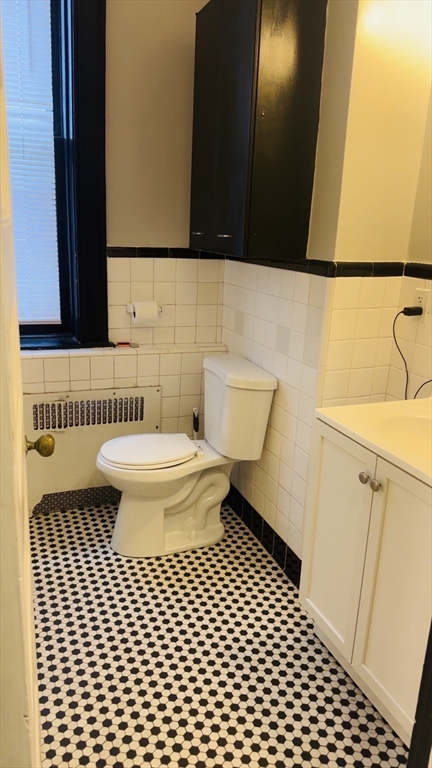 21 Beacon Street, Unit 6D Boston, MA 02108 - Photo 17 of 21 a bathroom with a sink a toilet and a mirror