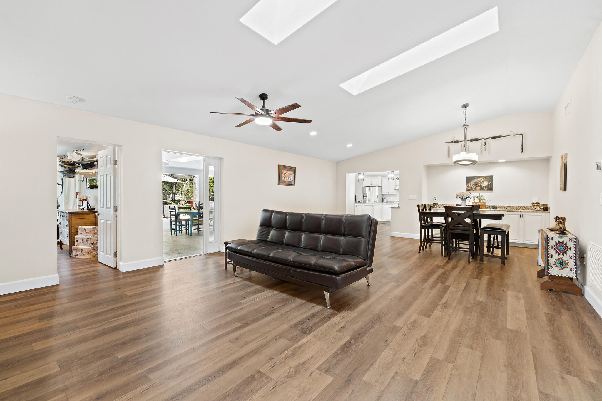 810 Knecht Road Northeast Palm Bay, FL 32905 - Photo 14 of 63 a living room with furniture and wooden floor