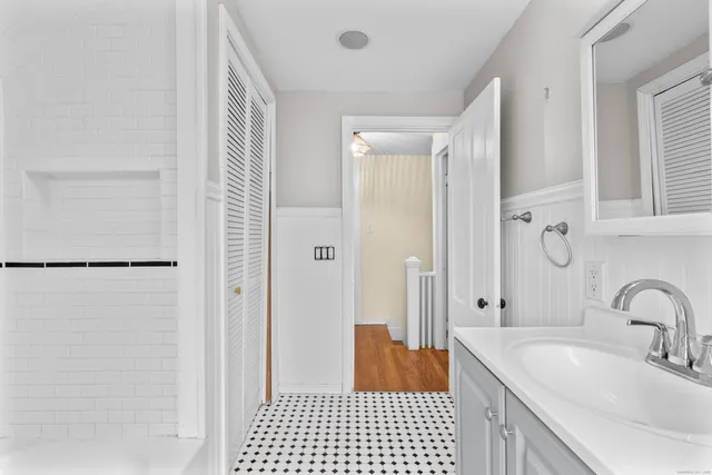 a bathroom with a sink and a mirror