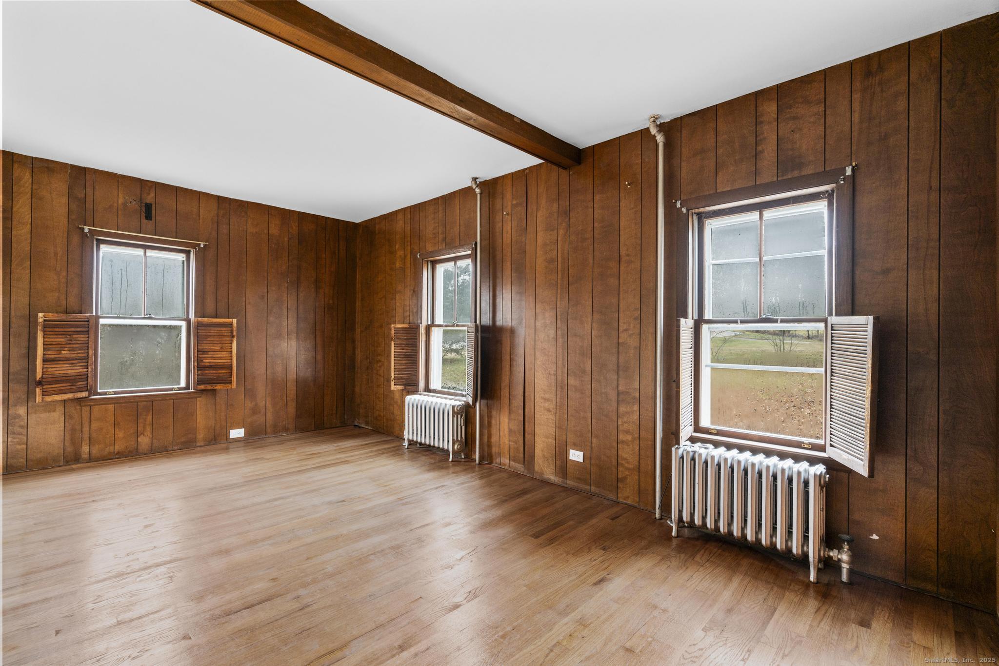 162 Scotland Road Windham, CT 06280 - Photo 15 of 31 an empty room with wooden floor and windows