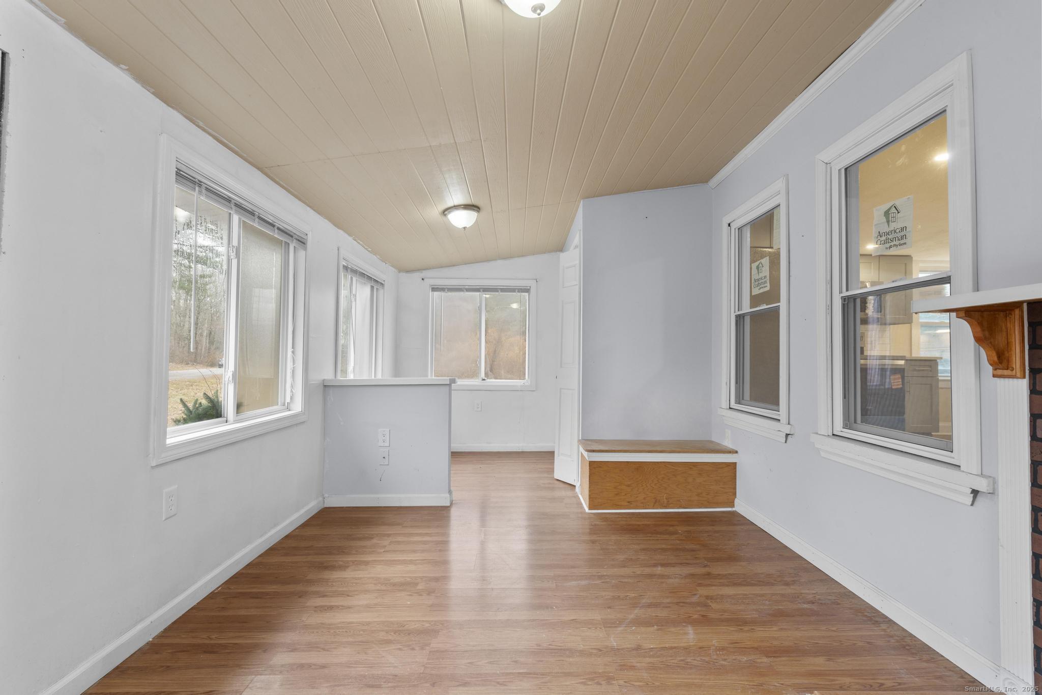 162 Scotland Road Windham, CT 06280 - Photo 17 of 31 a view of an empty room with wooden floor and a window