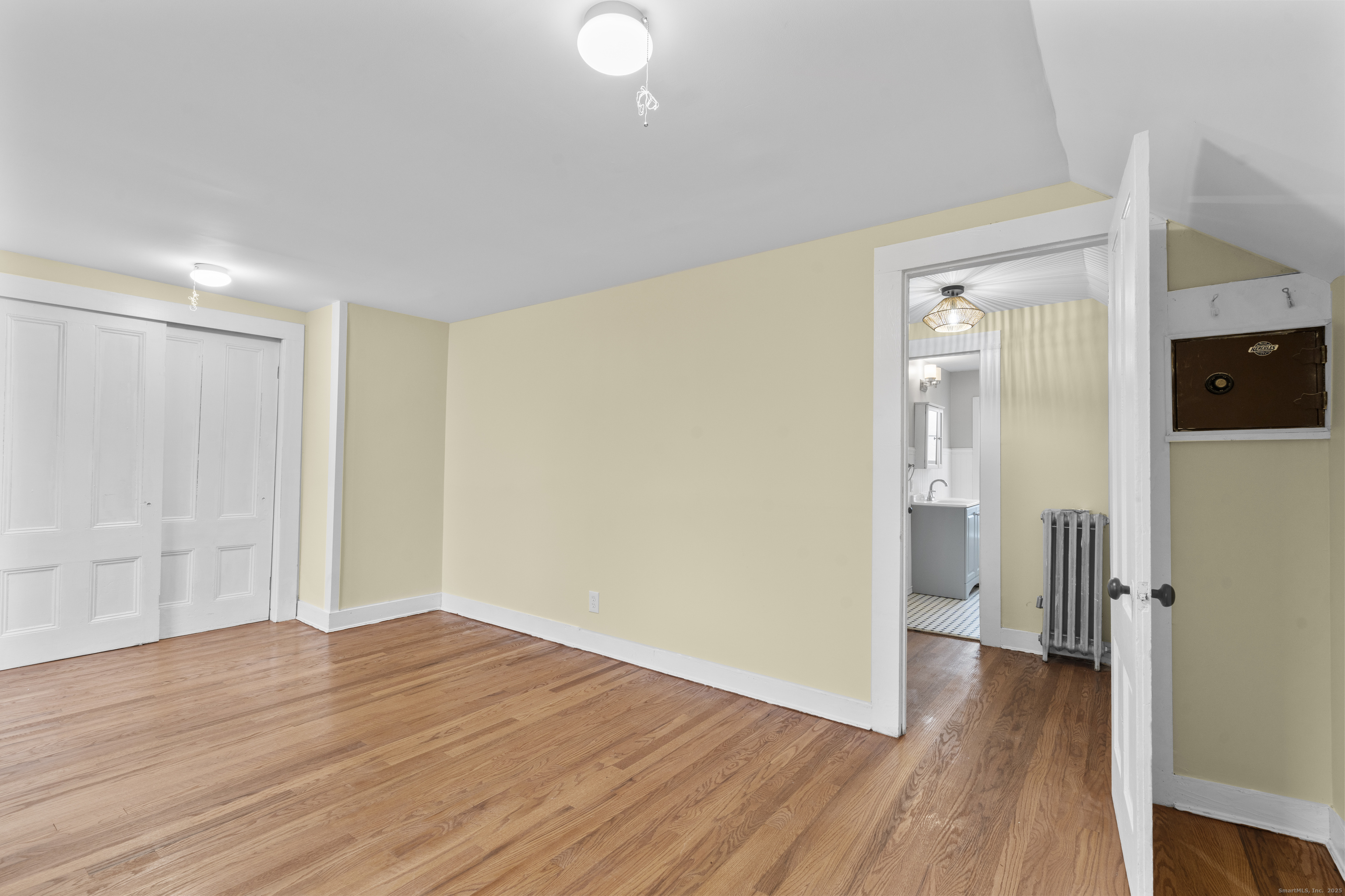 162 Scotland Road Windham, CT 06280 - Photo 25 of 31 a view of a room with wooden floor and a kitchen
