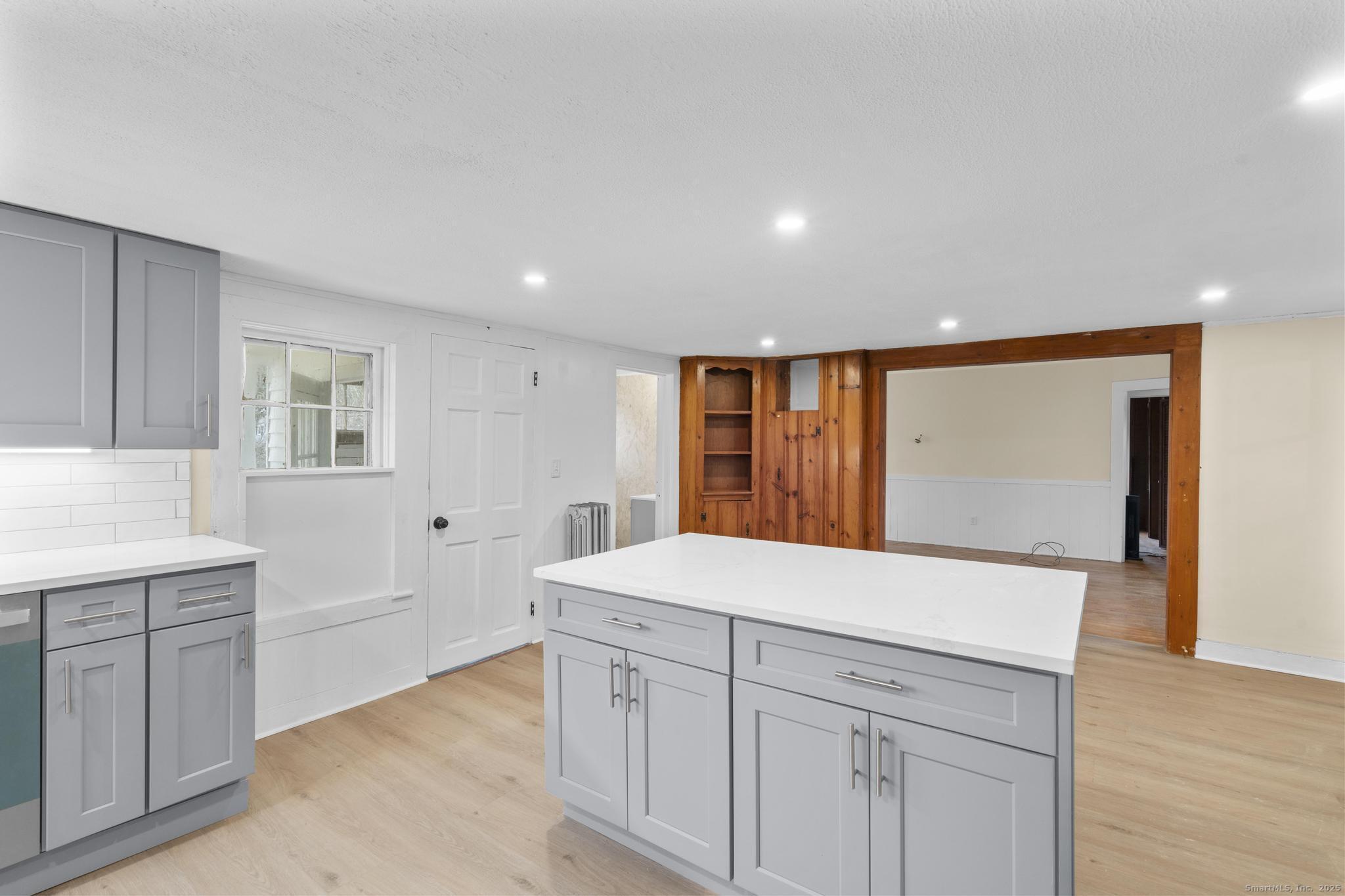 162 Scotland Road Windham, CT 06280 - Photo 8 of 31 a kitchen with a sink and dishwasher with wooden floor