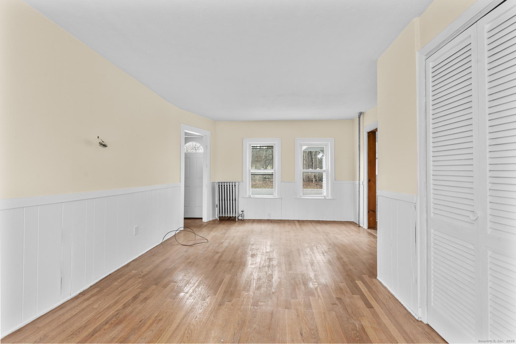 162 Scotland Road Windham, CT 06280 - Photo 9 of 31 a view of empty room with wooden floor and fan