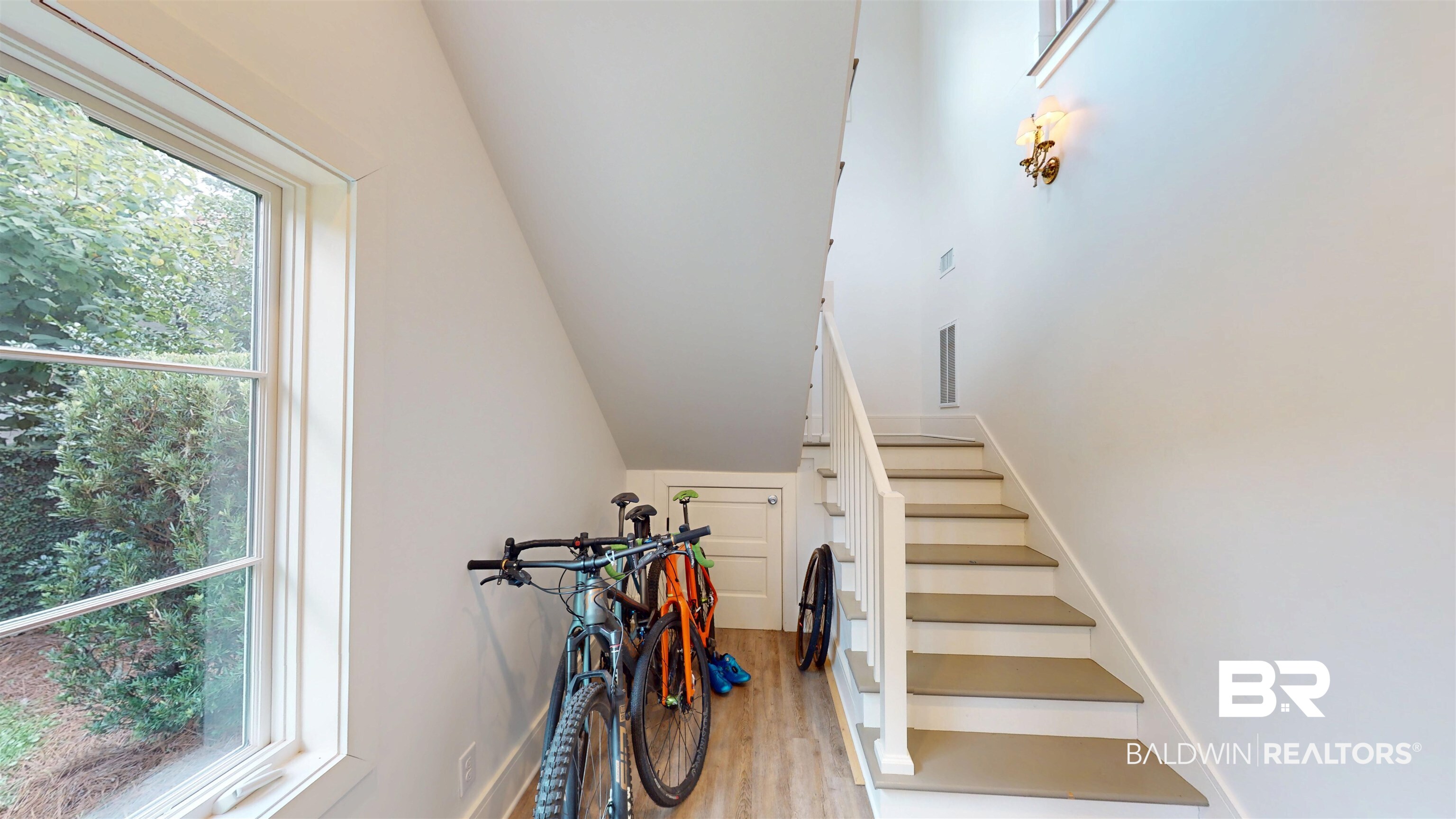 211 Lanier Avenue Mobile, AL 36607 - Photo 66 of 73 Stairway featuring wood finished floors and vaulted ceiling
