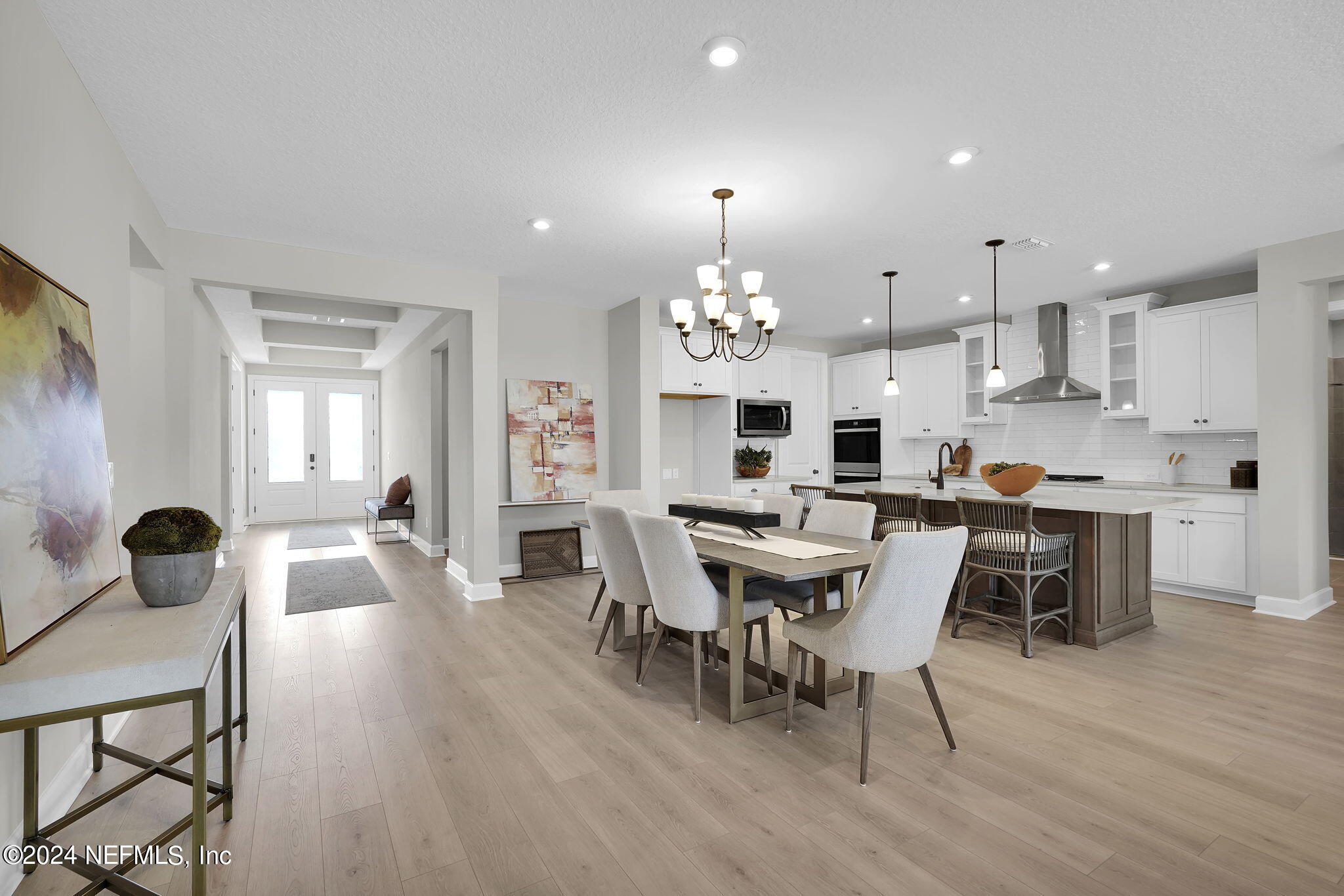 117 Greylock Lane St. Augustine, FL 32092 - Photo 16 of 48 a view of a dining room with furniture and wooden floor