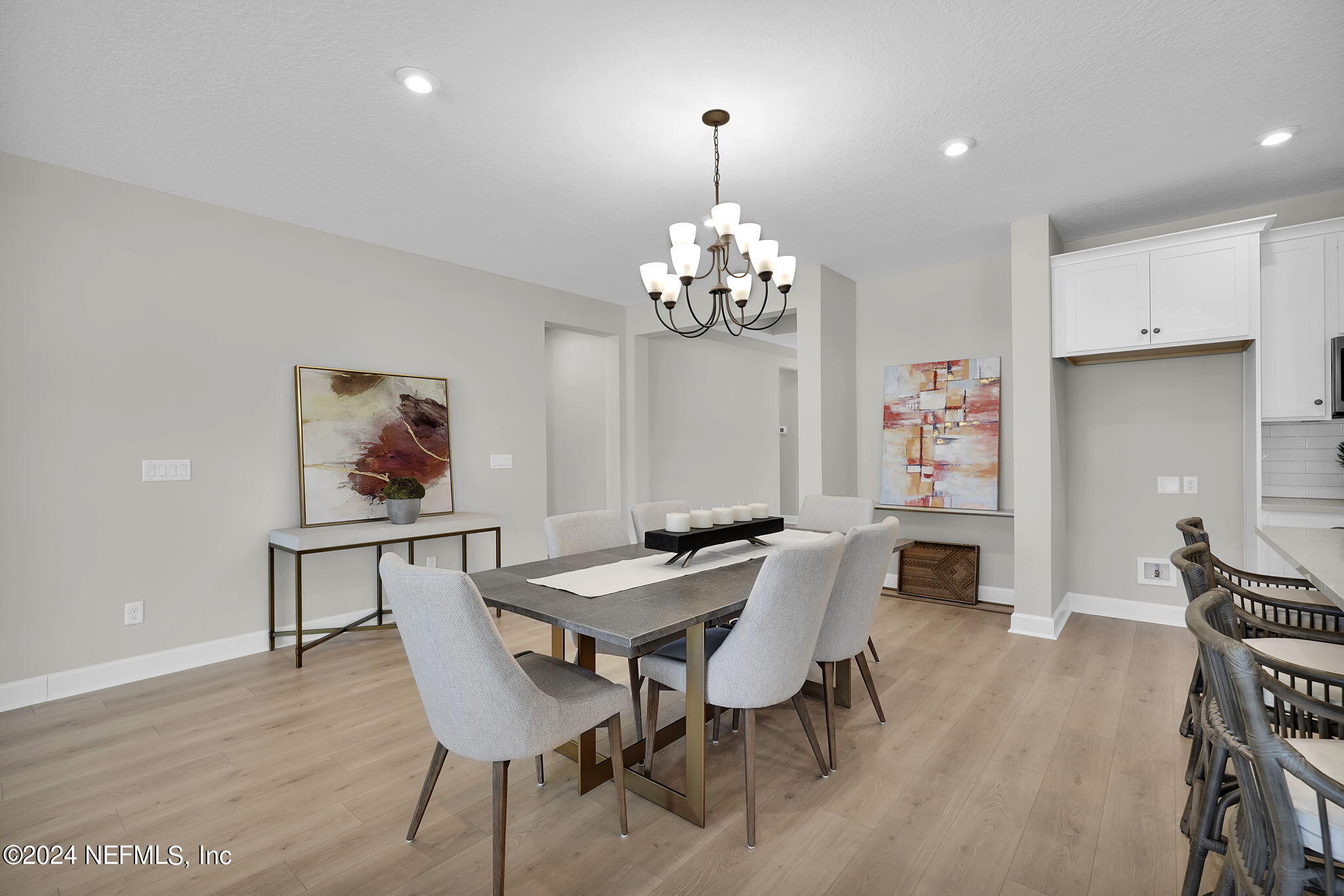 117 Greylock Lane St. Augustine, FL 32092 - Photo 17 of 48 a dining room with furniture a chandelier and wooden floor