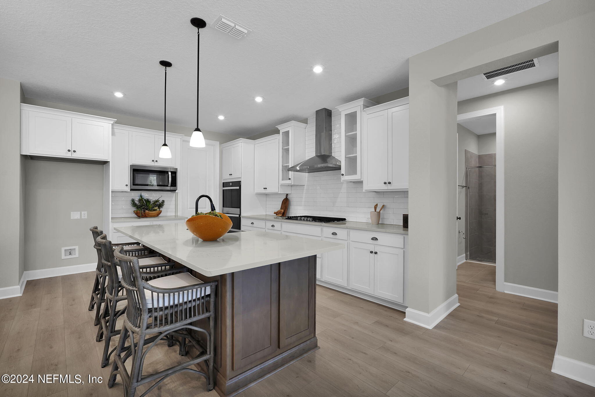 117 Greylock Lane St. Augustine, FL 32092 - Photo 19 of 48 a kitchen with a sink a center island stainless steel appliances and cabinets