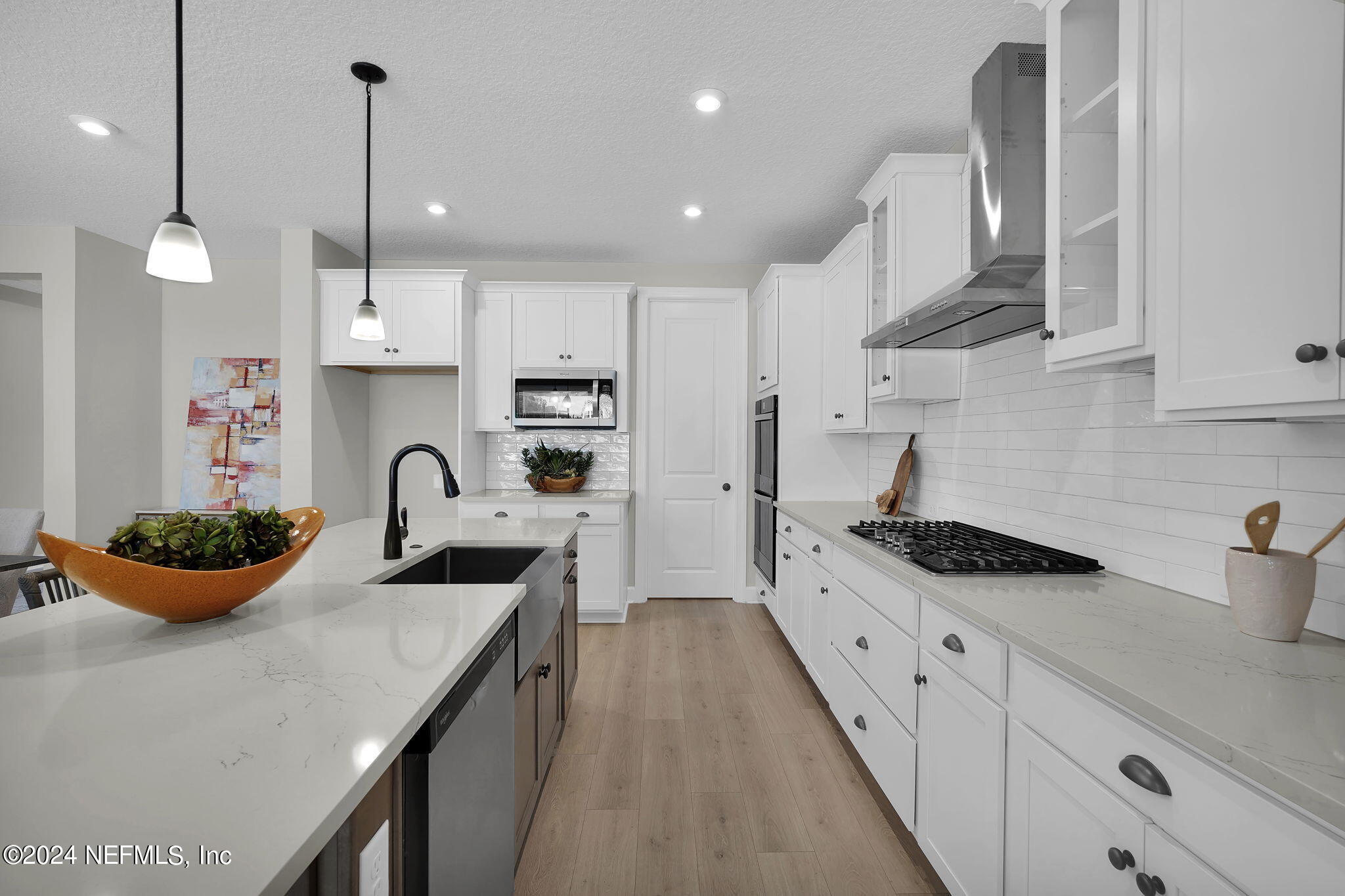 117 Greylock Lane St. Augustine, FL 32092 - Photo 20 of 48 a kitchen with stainless steel appliances kitchen island granite countertop a sink a stove and cabinets