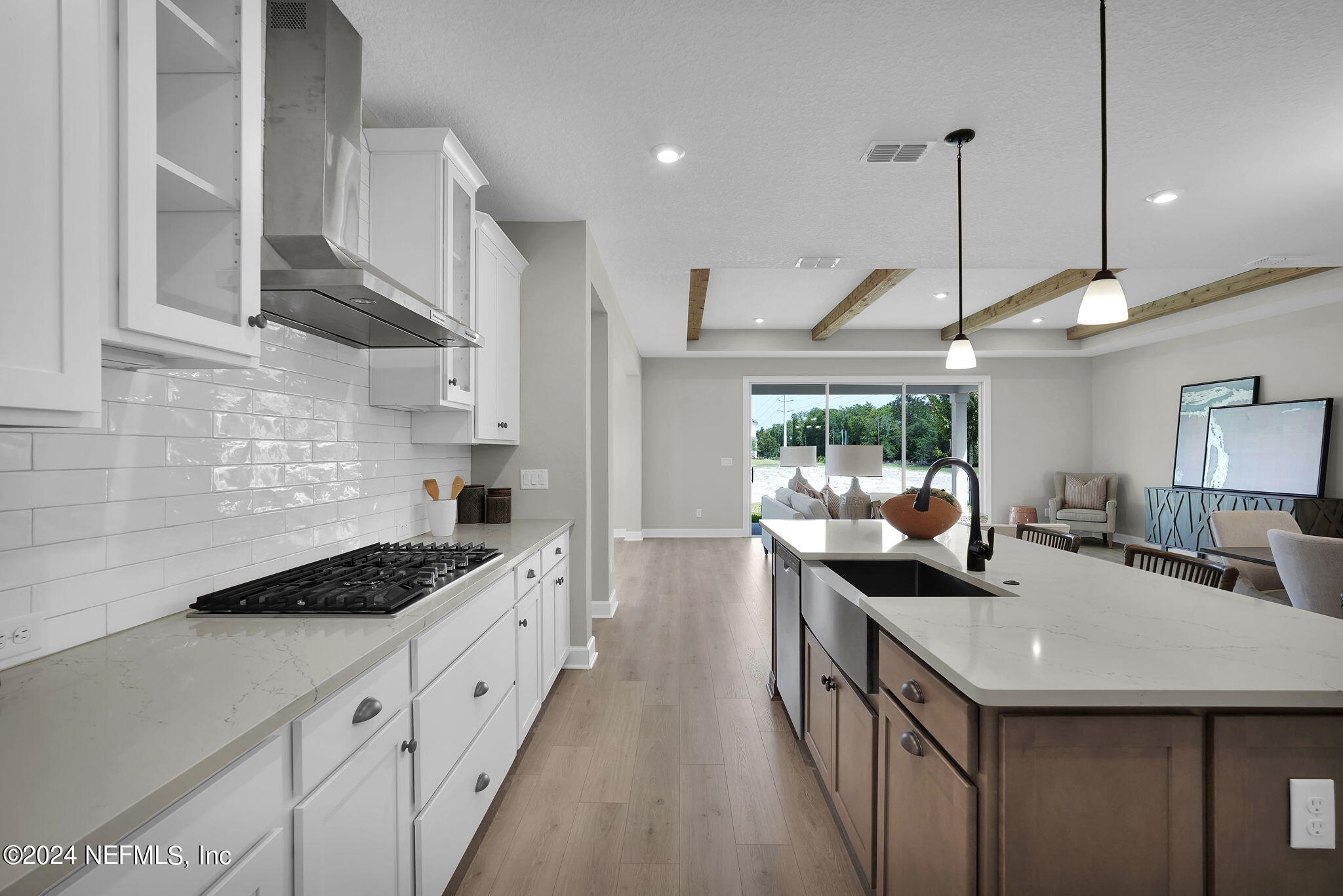 117 Greylock Lane St. Augustine, FL 32092 - Photo 22 of 48 a kitchen with stainless steel appliances granite countertop a sink a stove and a wooden floors