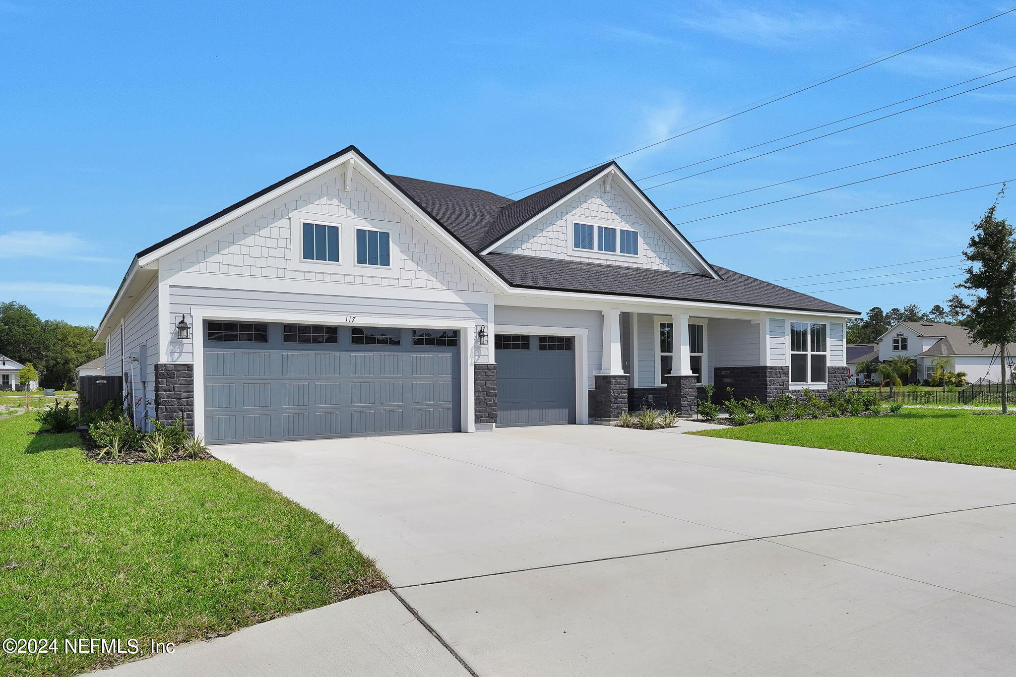 117 Greylock Lane St. Augustine, FL 32092 - Photo 3 of 48 a front view of a house with a yard and garage