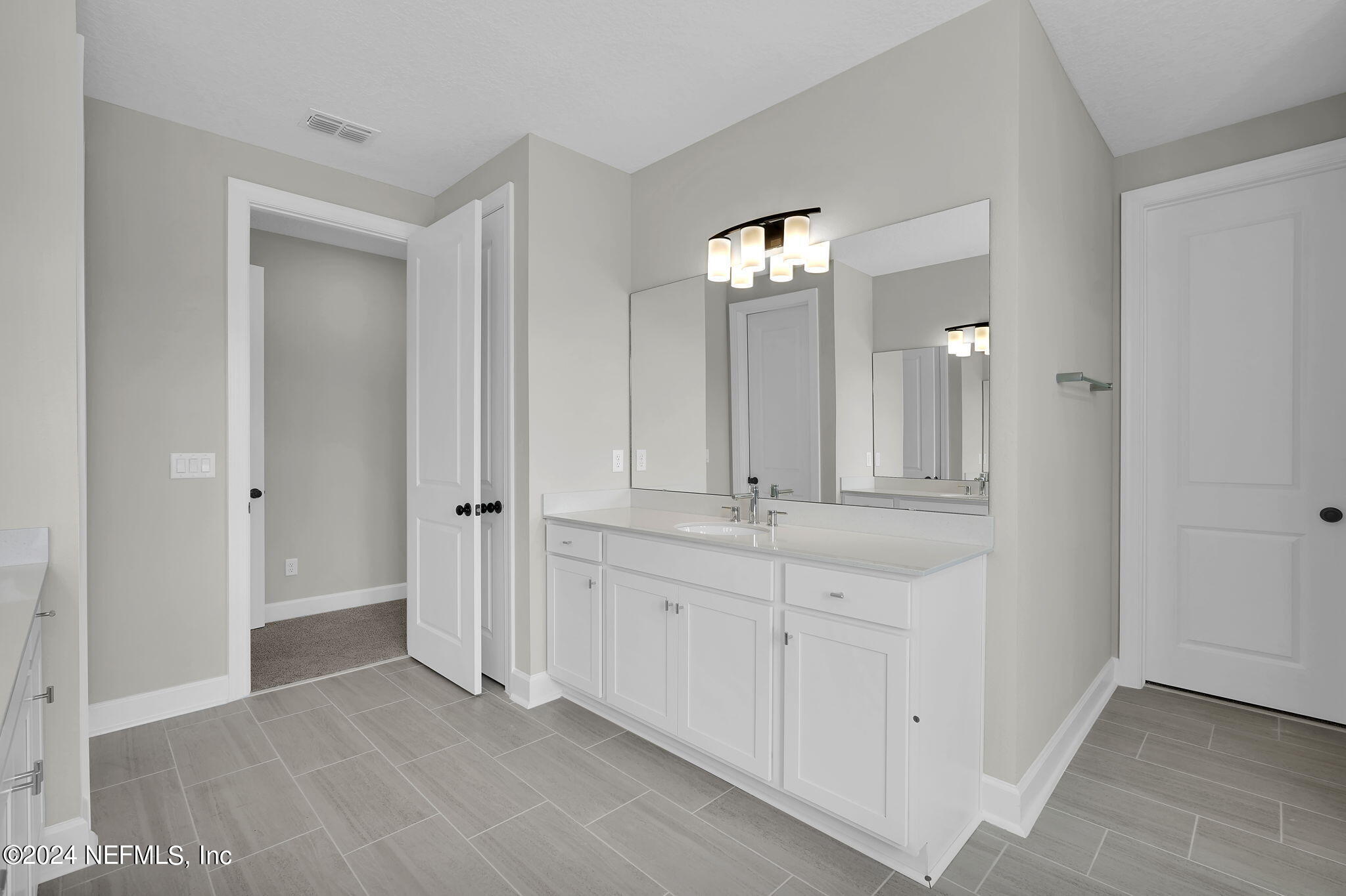 117 Greylock Lane St. Augustine, FL 32092 - Photo 35 of 48 wooden floor with white doors