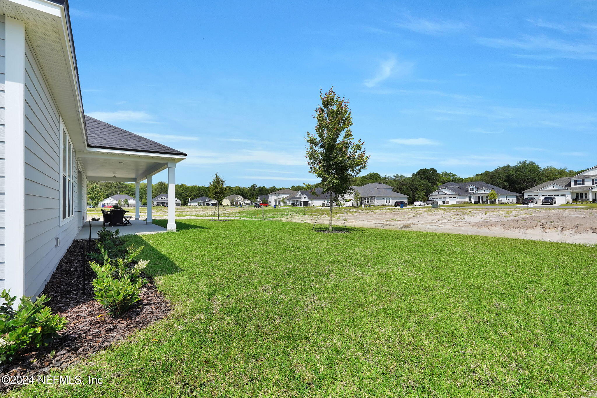 117 Greylock Lane St. Augustine, FL 32092 - Photo 41 of 48 a view of backyard with outdoor seating and green space